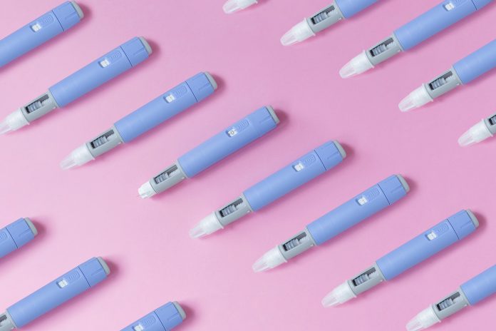 Medical,Drug,Ozempic,Injection,Lies,On,A,Pink,Background,,Top